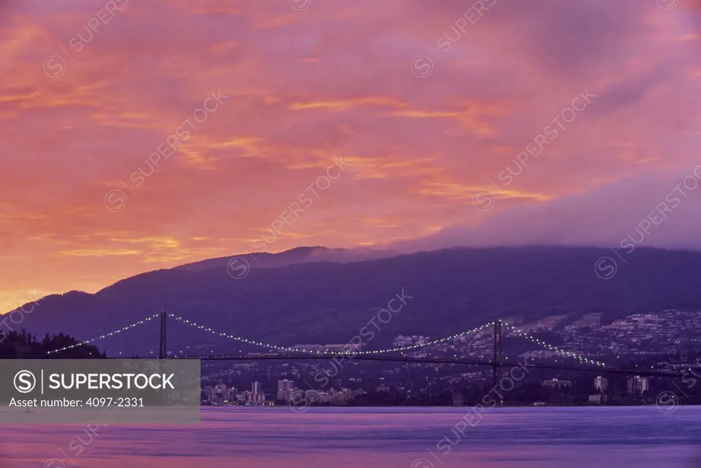 Suspension bridge lit up at dusk, Lions Gate Bridge, Stanley Park, Vancouver, British Columbia, Canada