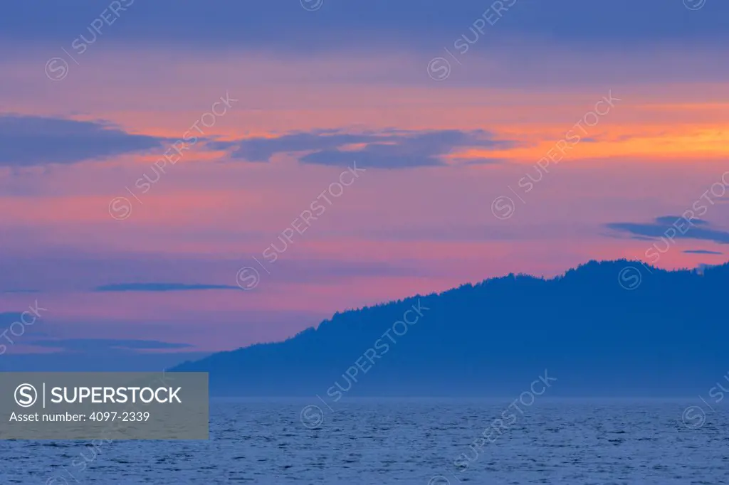 Silhouette of an island at dusk, English Bay, Vancouver, British Columbia, Canada