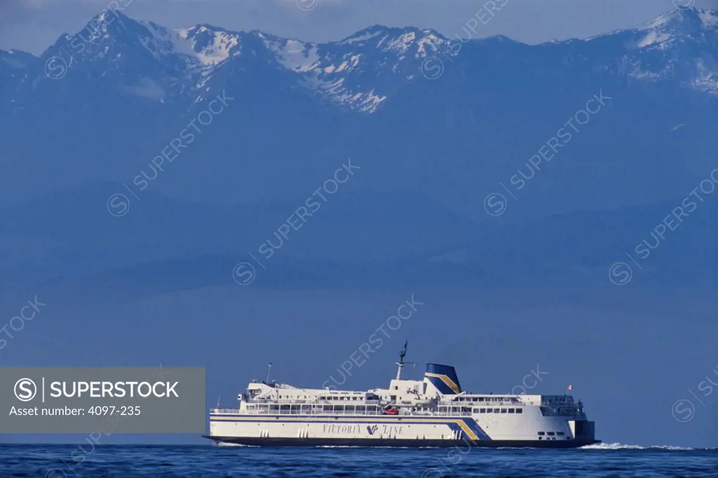 Ferry in the sea, Strait Of Juan De Fuca, Olympic Mountains, Victoria, Vancouver Island, British Columbia, Canada