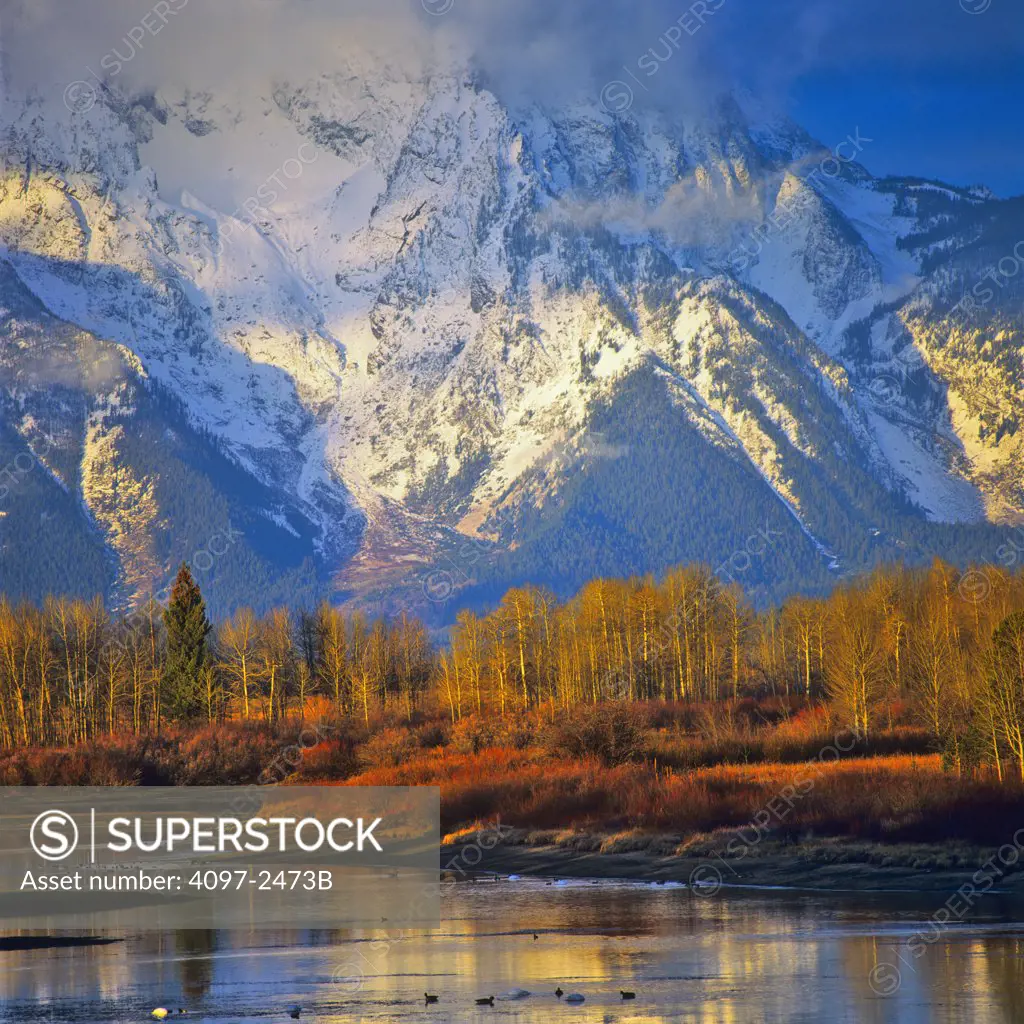 Reflection of mountains in a river, Mt Moran, Snake River, Grand Teton National Park, Wyoming, USA