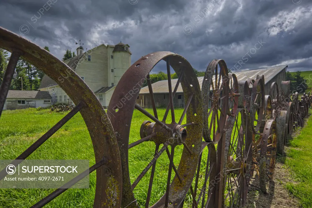 Wagon wheel fence in a field, Palouse, Washington State, USA