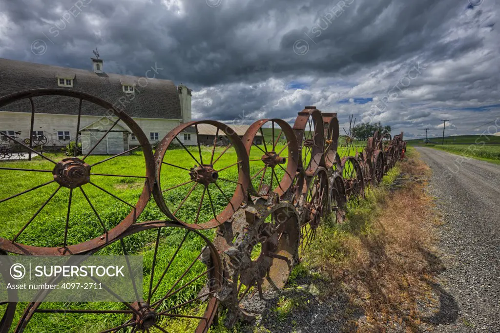 Wagon wheel fence in a field, Palouse, Washington State, USA