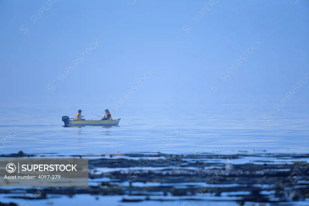 People fishing in the sea, Victoria, Vancouver Island, British Columbia, Canada