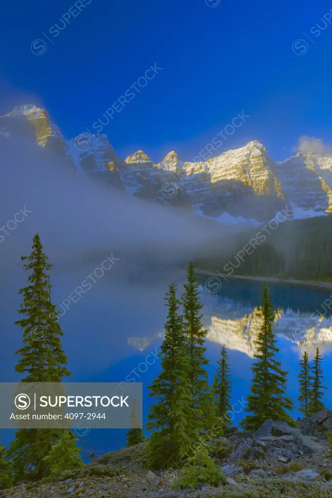 Reflection of a mountain range in a lake, Wenkchemna Range, Moraine Lake, Valley Of The Ten Peaks, Banff National Park, Alberta, Canada