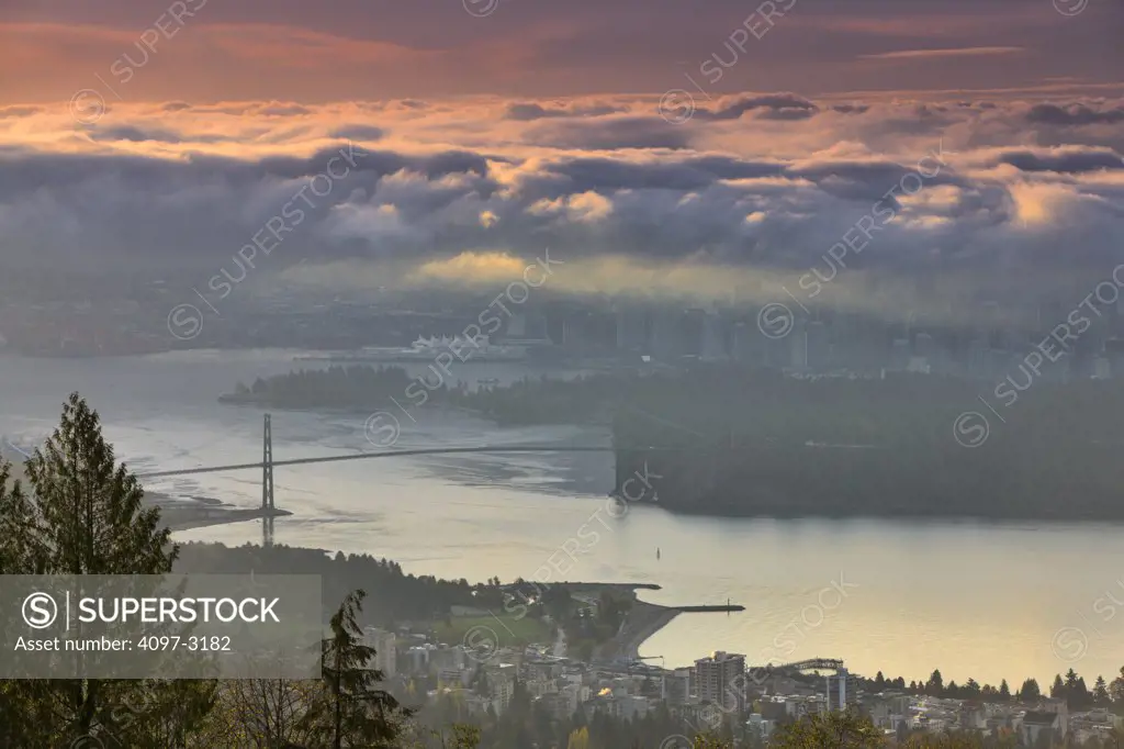 Canada, British Columbia, Vancouver, View of Lions Gate Bridge from Stanley Park at dusk