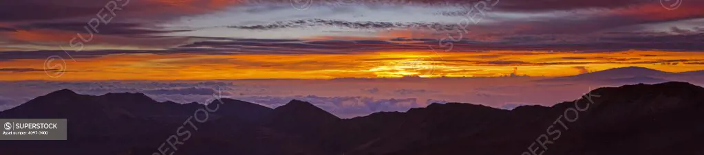 Clouds over mountains at sunrise, Haleakala, Maui, Hawaii, USA
