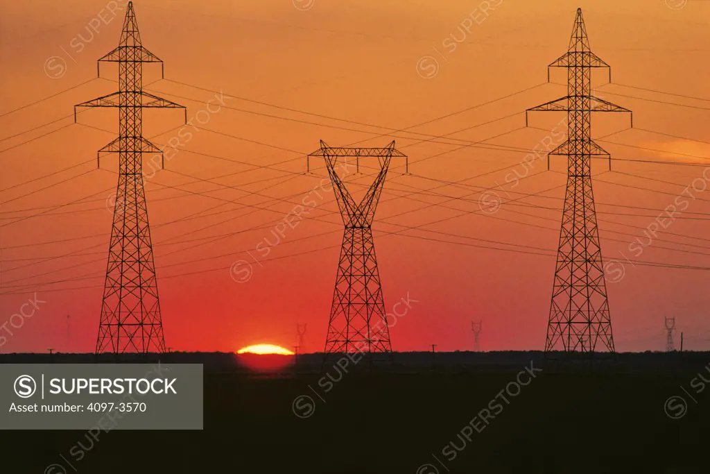 Electricity pylons at sunrise, Manitoba, Canada