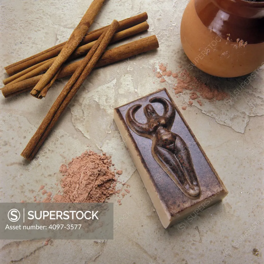 Cinnamon sticks with powder and bar of soap