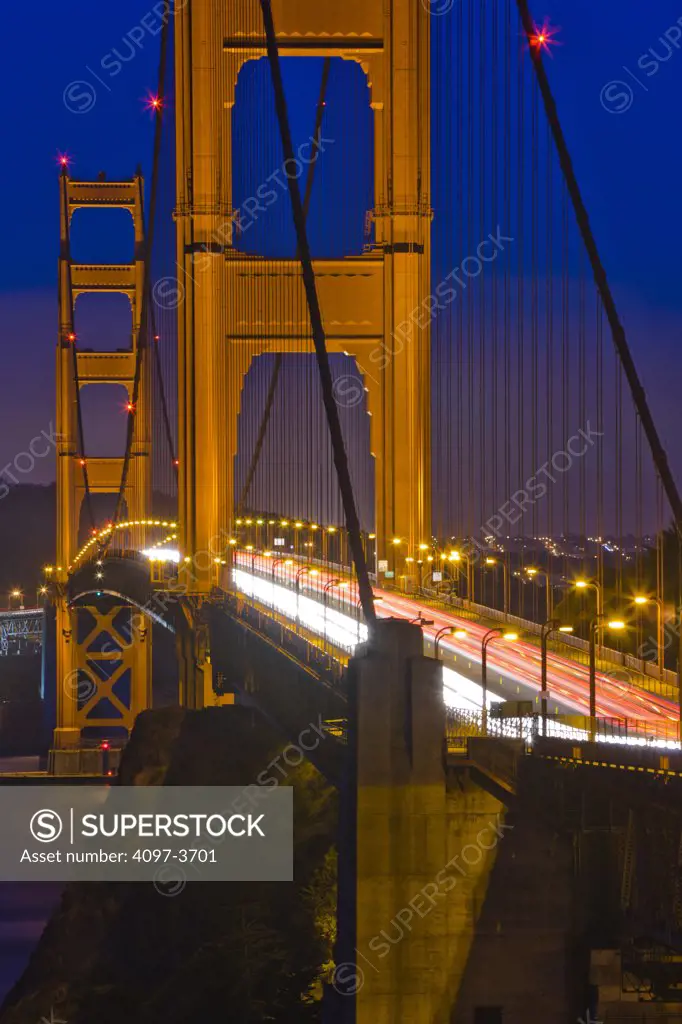 Traffic on a suspension bridge at night, Golden Gate Bridge, San Francisco Bay, San Francisco, California, USA