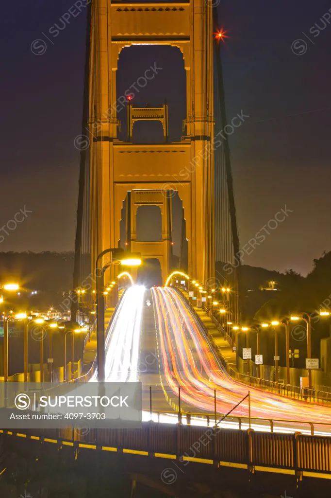 Traffic on a suspension bridge at night, Golden Gate Bridge, San Francisco Bay, San Francisco, California, USA