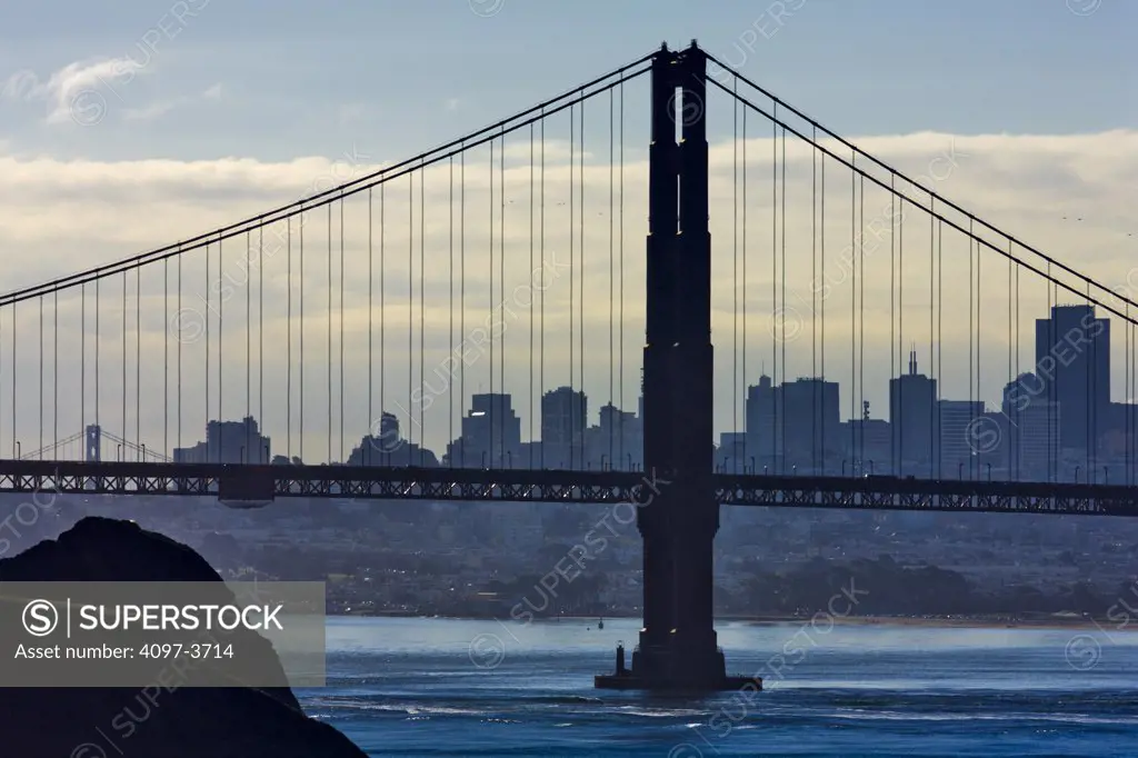 Suspension bridge across the bay with city skyline in the background, Golden Gate Bridge, San Francisco Bay, San Francisco, California, USA