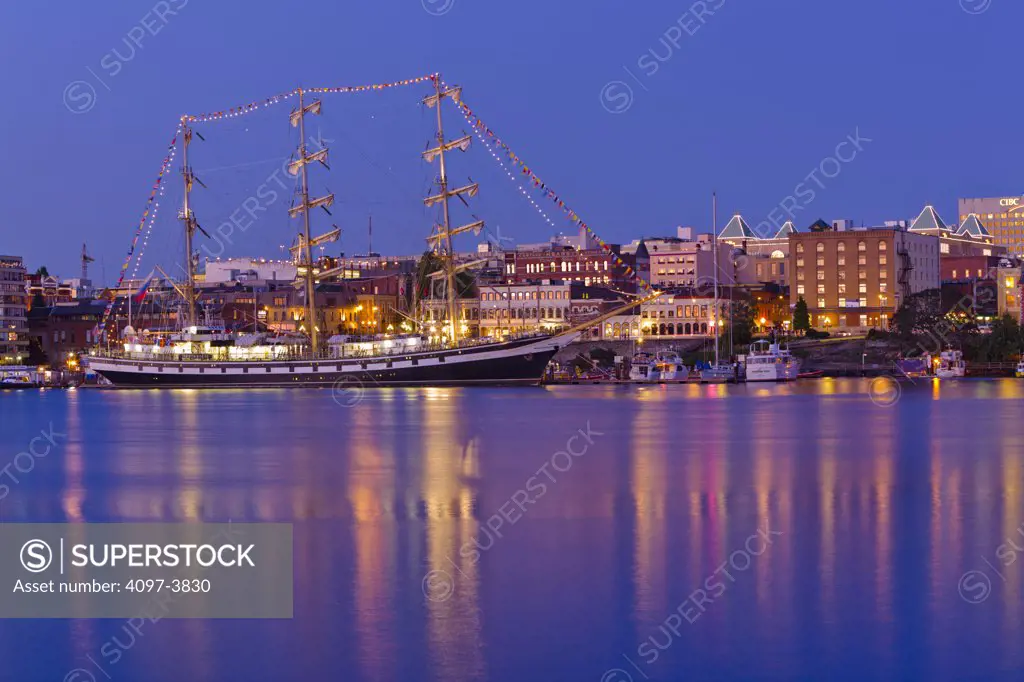 Canada, British Columbia, Victoria, moored ship with city in background