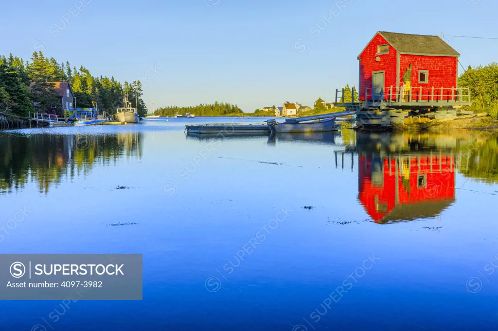 Reflection of a boat shed in water, Stonehurst East, Nova Scotia, Canada