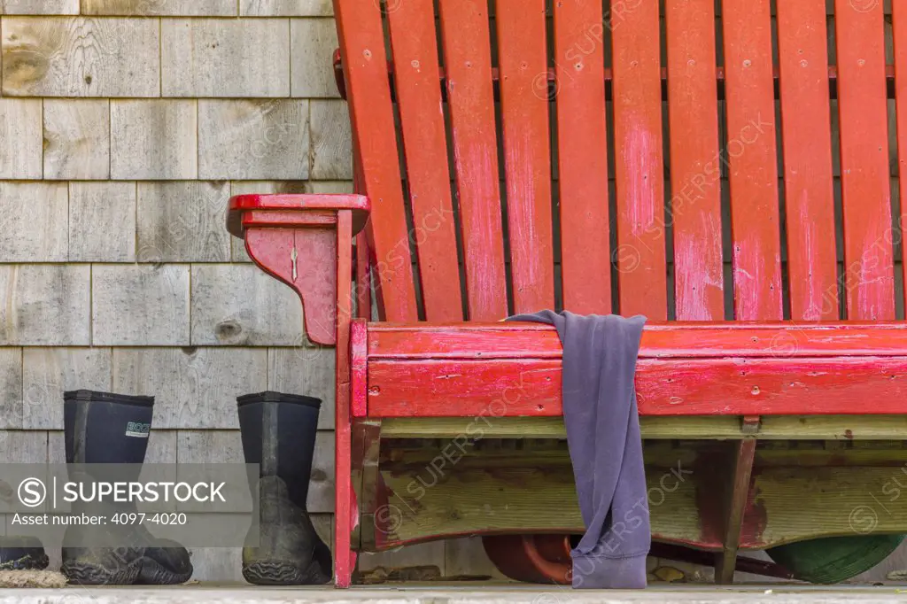 Close-up of a red bench on a porch, Rose Bay, Lunenburg County, Nova Scotia, Canada