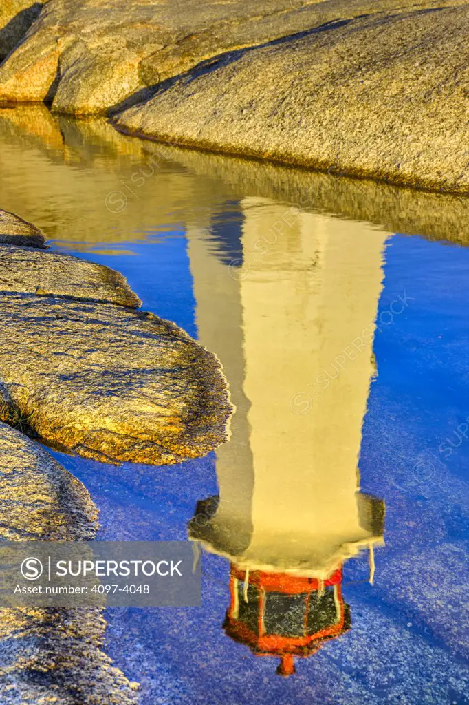 Reflection of a lighthouse in water, Peggy's Point Lighthouse, Peggy's Cove, St. Margarets Bay, Nova Scotia, Canada