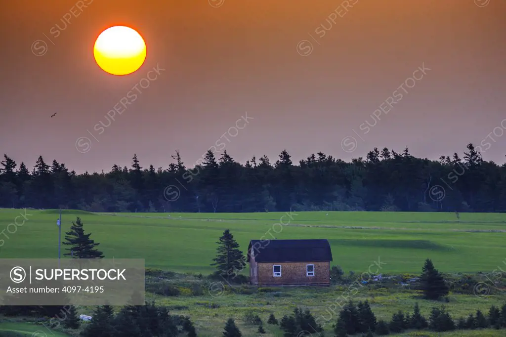 Sunrise over a field, North Rustico, Prince Edward Island, Canada