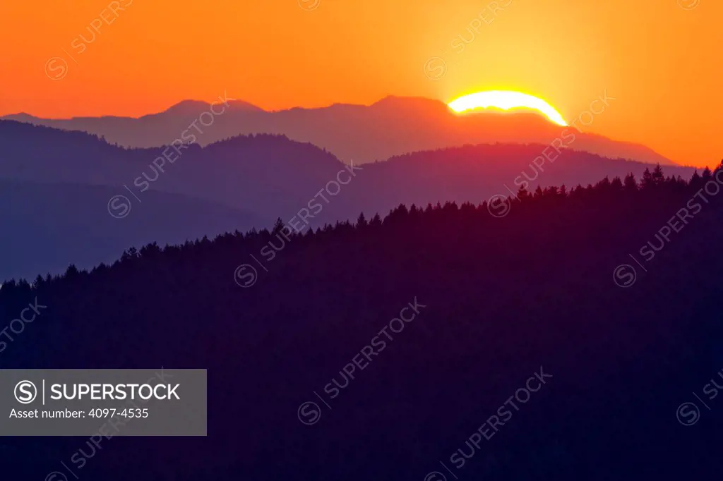 Canada, Vancouver Island, Sunrise over Highlands area of Victoria Vancouver Island, as seen from the Malahat drive