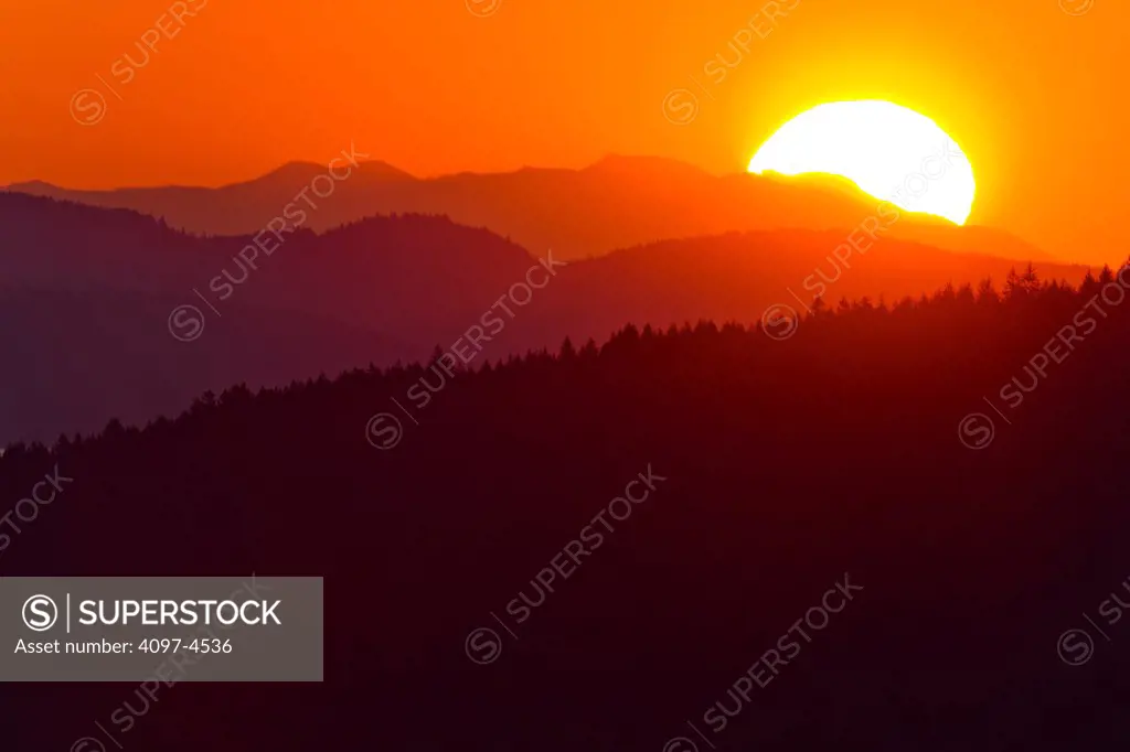 Canada, Vancouver Island, Sunrise over Highlands area of Victoria Vancouver Island, as seen from the Malahat drive