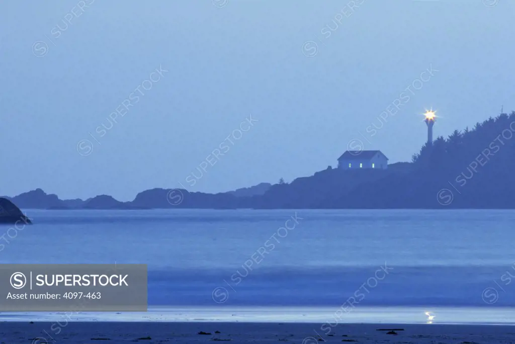 Lighthouse lit up at seaside, Pacific Rim National Park Reserve, Vancouver Island, British Columbia, Canada