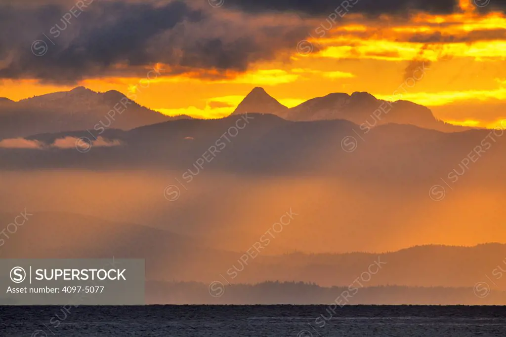 Canada, British Columbia, Vancouver Island, View of sea and mountains at sunset