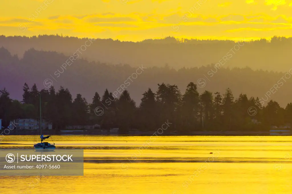 sail boat anchored in Sooke Harbor at sunrise, Vancouver Island