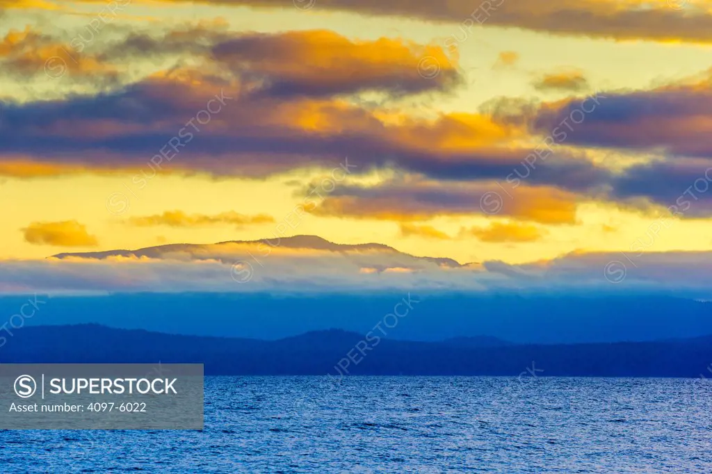 Canada, British Columbia, Vancouver Island, View of sunrise from Rathtrevor Beach