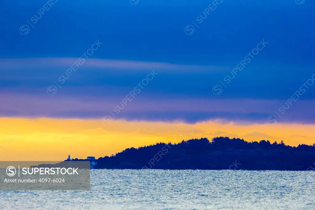 Canada, British Columbia, Vancouver Island, Ballenas Island lighthouse at sunrise