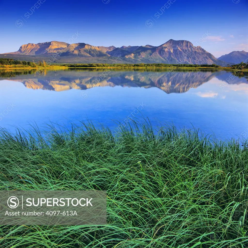Reflection of mountains in water, Sofa Mountain, Maskinonge Lake, Waterton Lakes National Park, Alberta, Canada