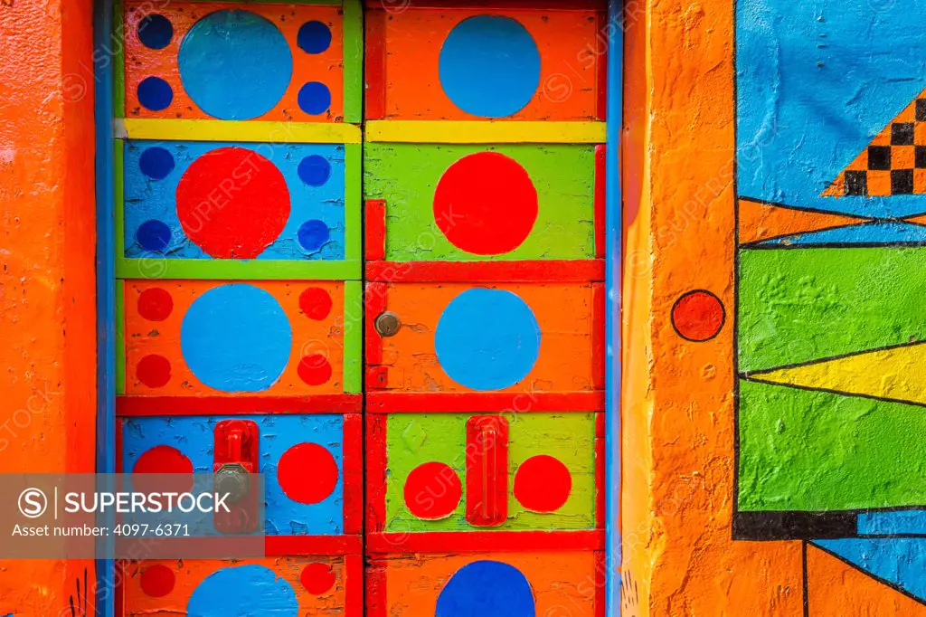 boldly colored and patterned door and wall, Island of Burano off Venice
