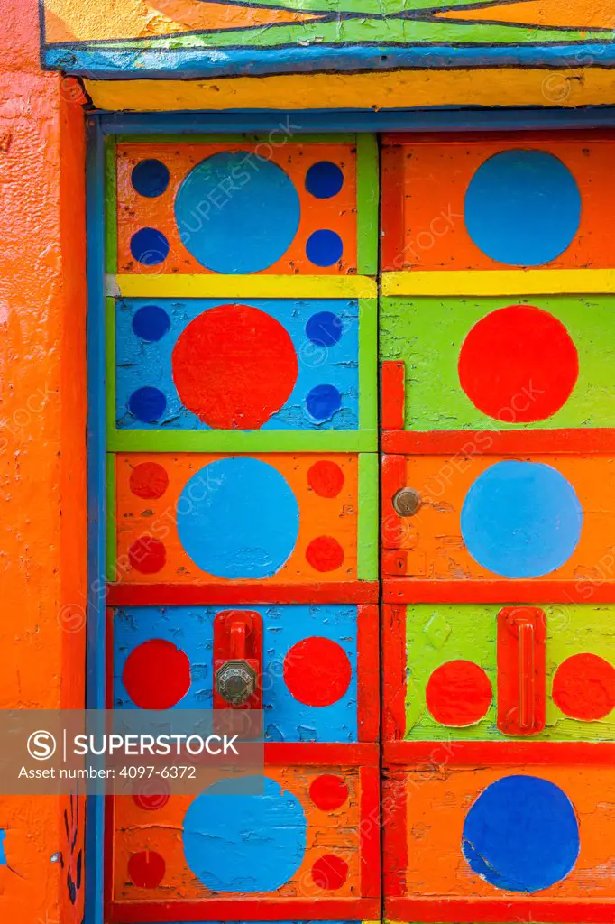 boldly colored and patterned door and wall, Island of Burano off Venice