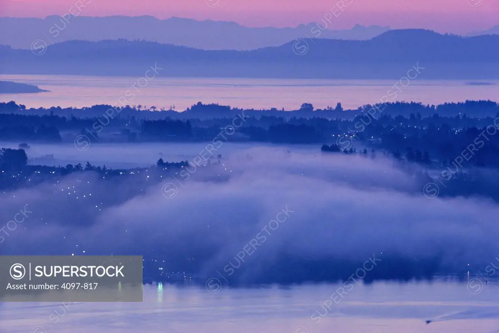 Town covered with fog viewed from Malahat, Finlayson Arm, Brentwood Bay, Saanich Peninsula, Vancouver Island, British Columbia, Canada