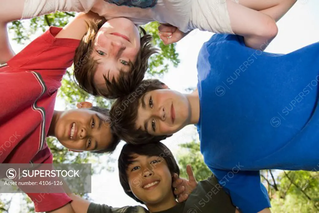 Low angle view of boys in a huddle