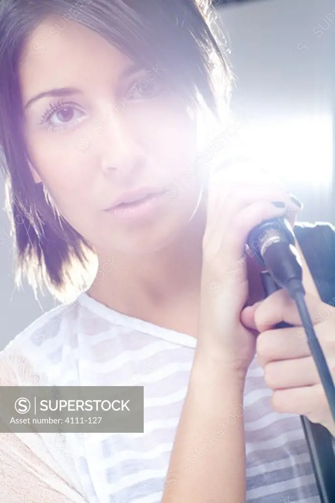 Portrait of a woman with a microphone