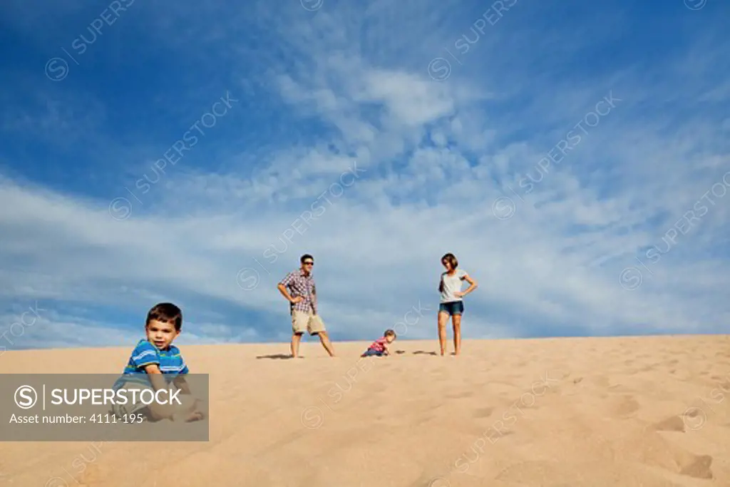 Family enjoying on sand on the beach, Sleeping Bear Dunes National Lakeshore, Glen Arbor, Leelanau County, Michigan, USA