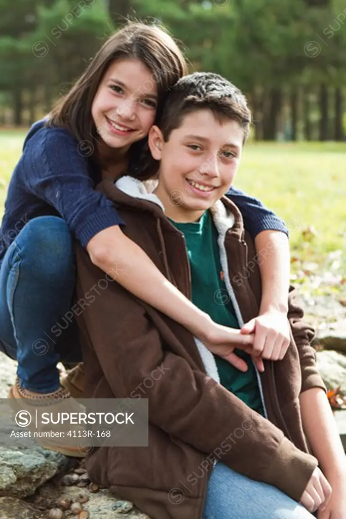 Portrait of brother and sister outdoors