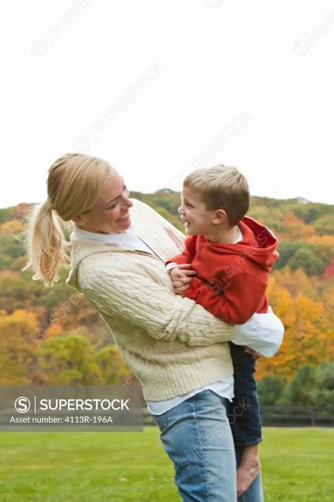 Mother playing with son on field
