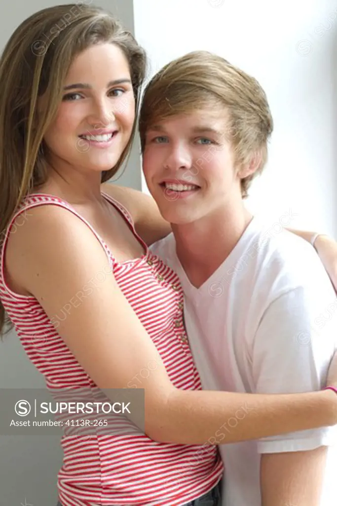 Portrait of Teenage couple embracing
