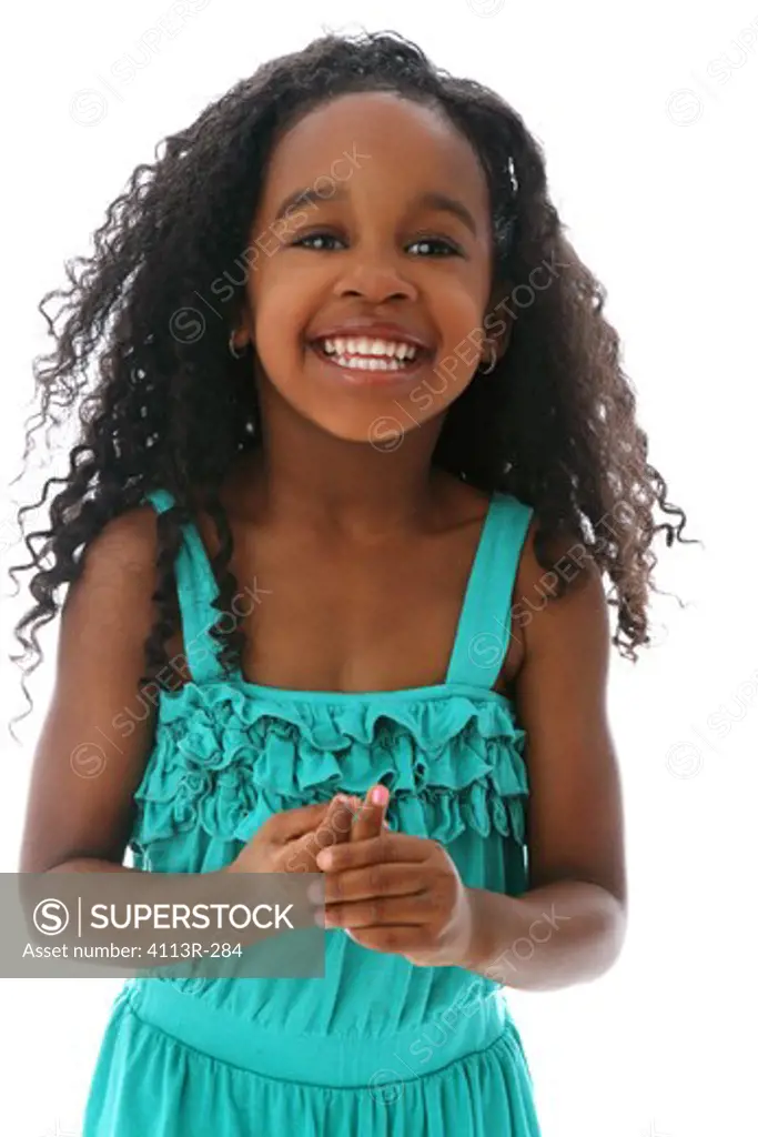 Studio shot portrait of girl in turquoise dress smiling