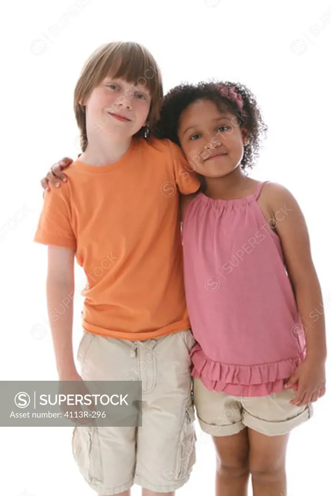 Studio shot of boy and girl standing and leaning on each other