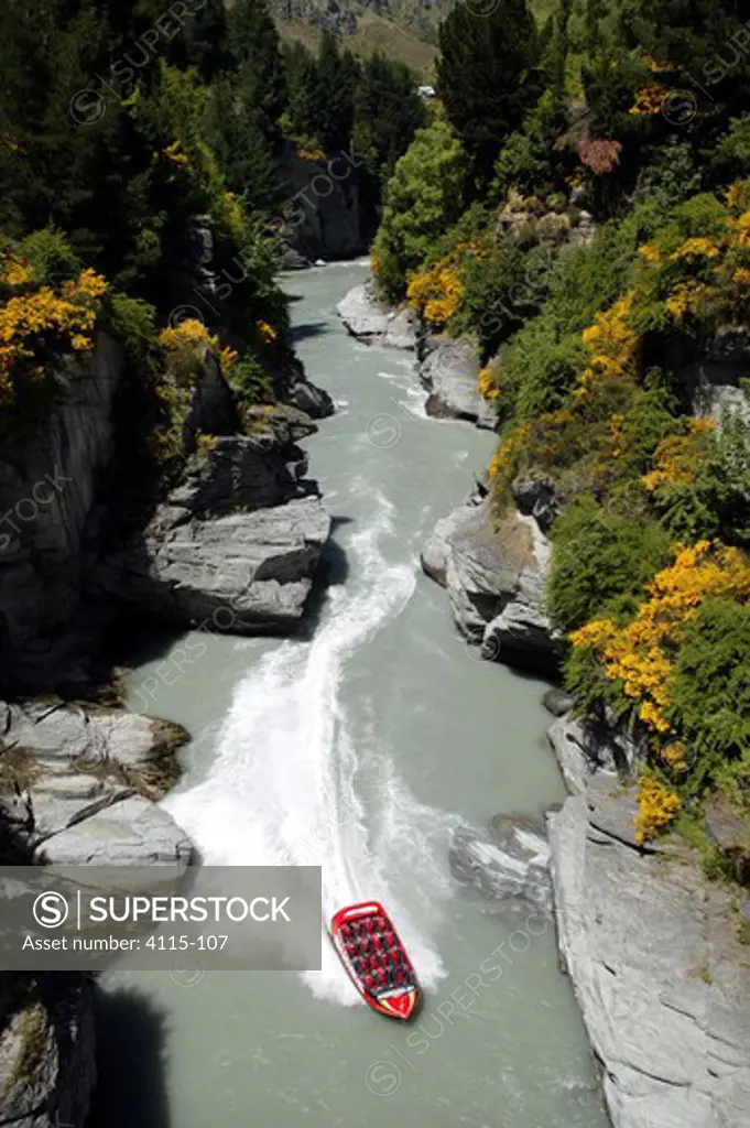 View down the gorge at jet boat on the Shotover River, Queenstown, New Zealand.