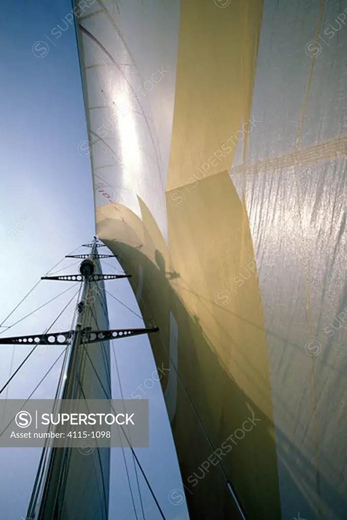 Crew member checking the rigging aboard a race yacht.
