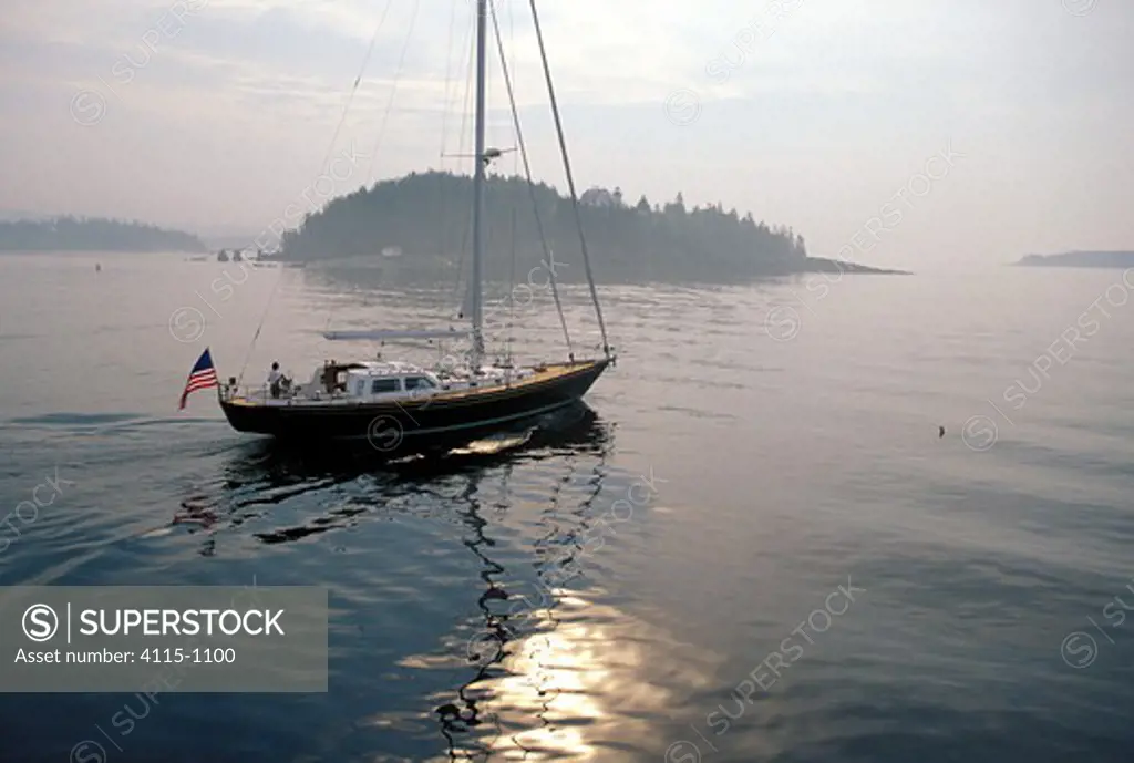 A Hinckley motoring on a calm morning in Maine, USA