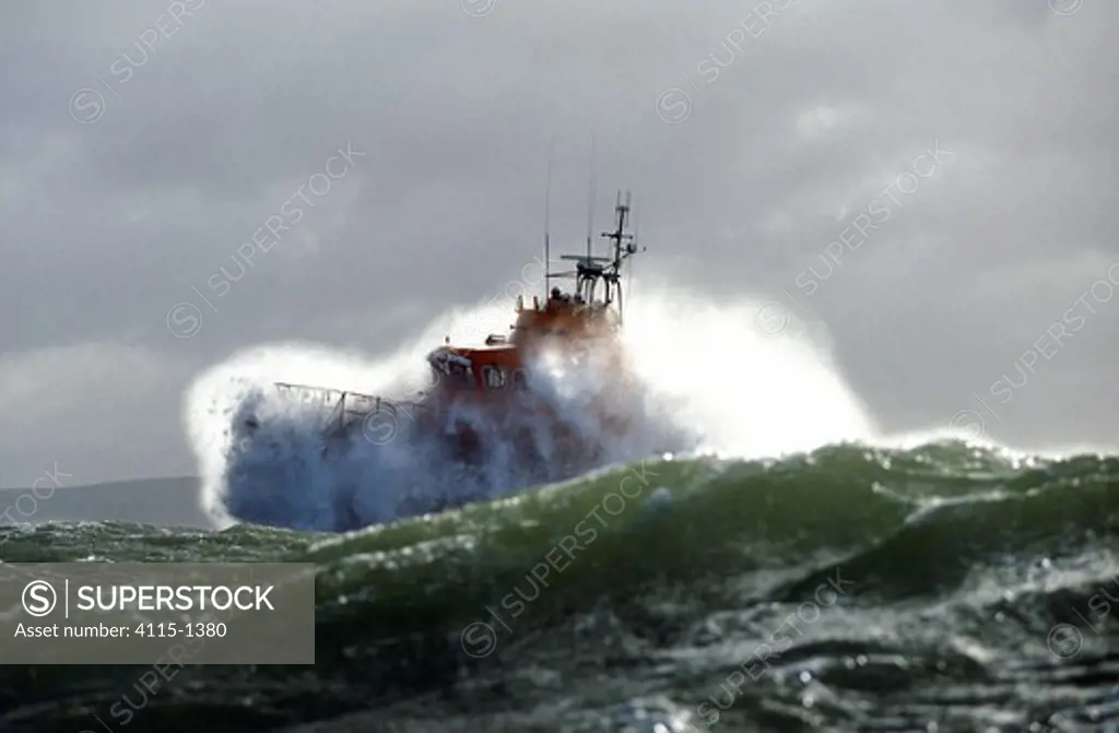 RNLI Lifeboat powering through heavy seas.