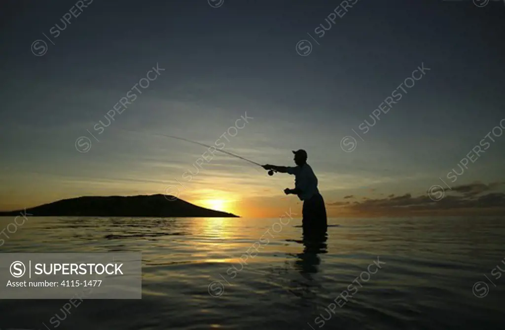 Salt water fly fishing at sunset, on the sand banks of Tevawa, Fiji.