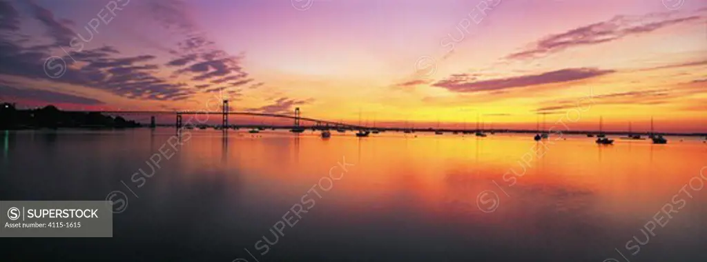 View of yachts and Newport Bridge from Jamestown at sunrise, Newport, Rhode Island, USA.