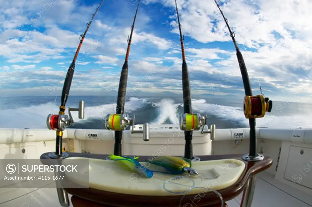 Heavy duty deep sea fishing reels lined up on the stern of a sport fishing boat, Guatemala.