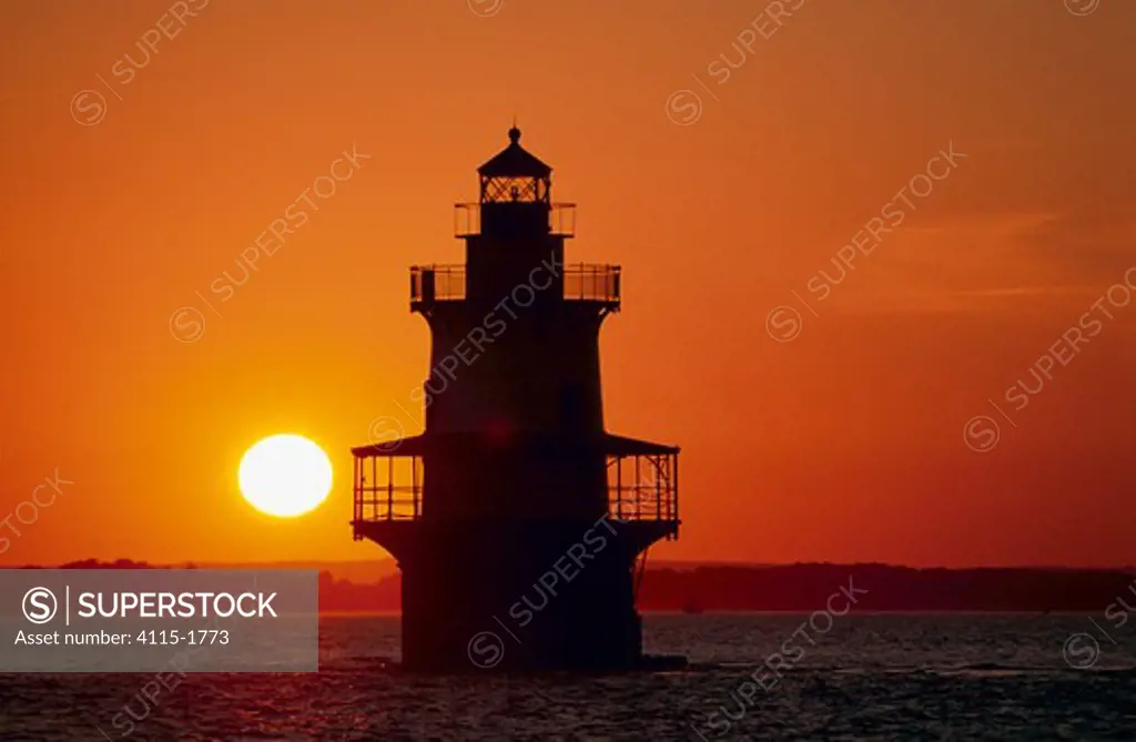 Silhouette of Hog Island Lighthouse at sunset, Bristol, Rhode Island, USA.