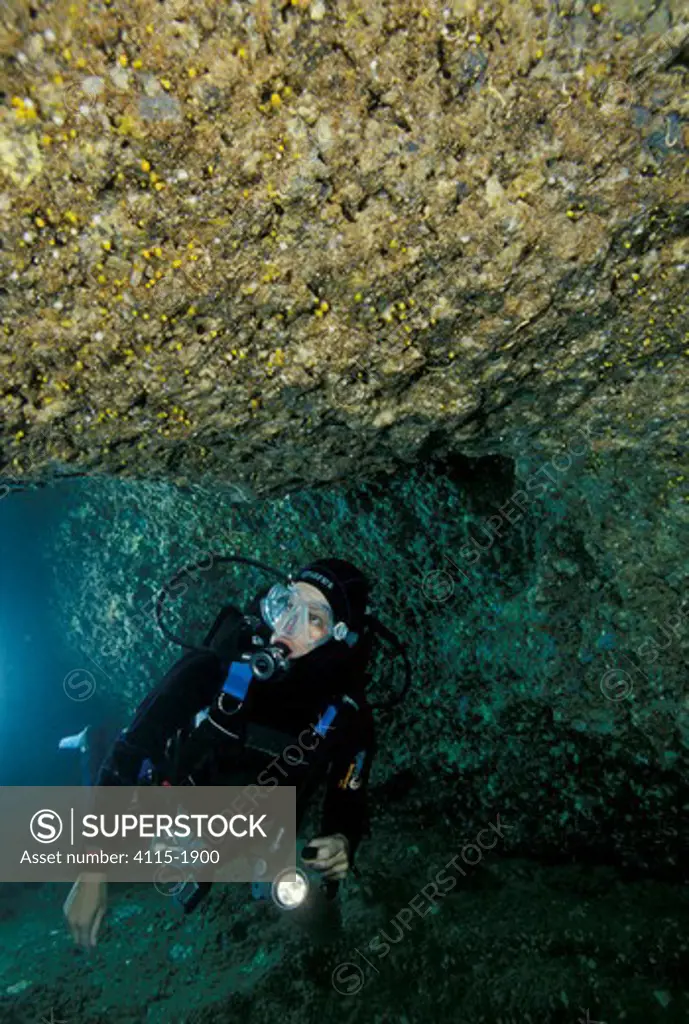 Diver in passage, Nereo cave, Alghero, Sardinia.