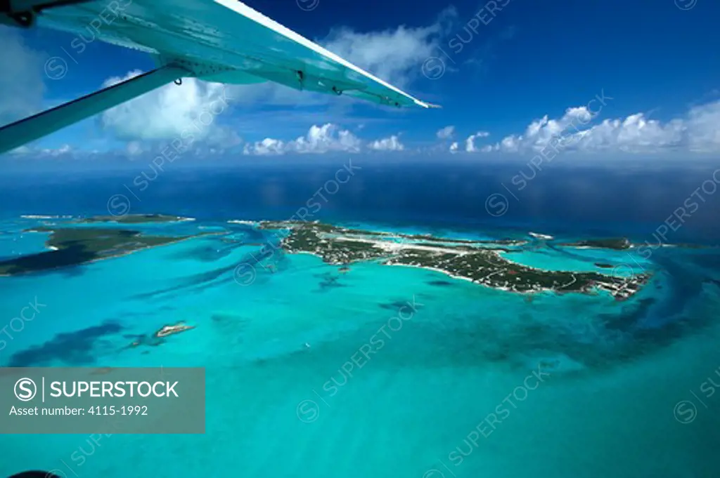 An aerial view, with aeroplane wing, of Exuma, part of the chain of 365 islands that form the Bahamas.