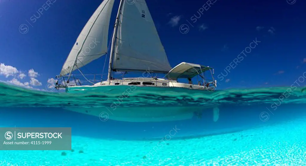 Split-level view of the hull of a Shannon Shoalsailor illustrating how this innovative, keelless, shallow draft beachboat is designed to roam shallow waters such as these in Exuma, the Bahamas